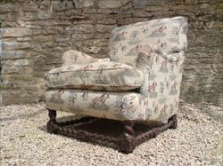 antique armchair made by Howard and Sons of London.jpg